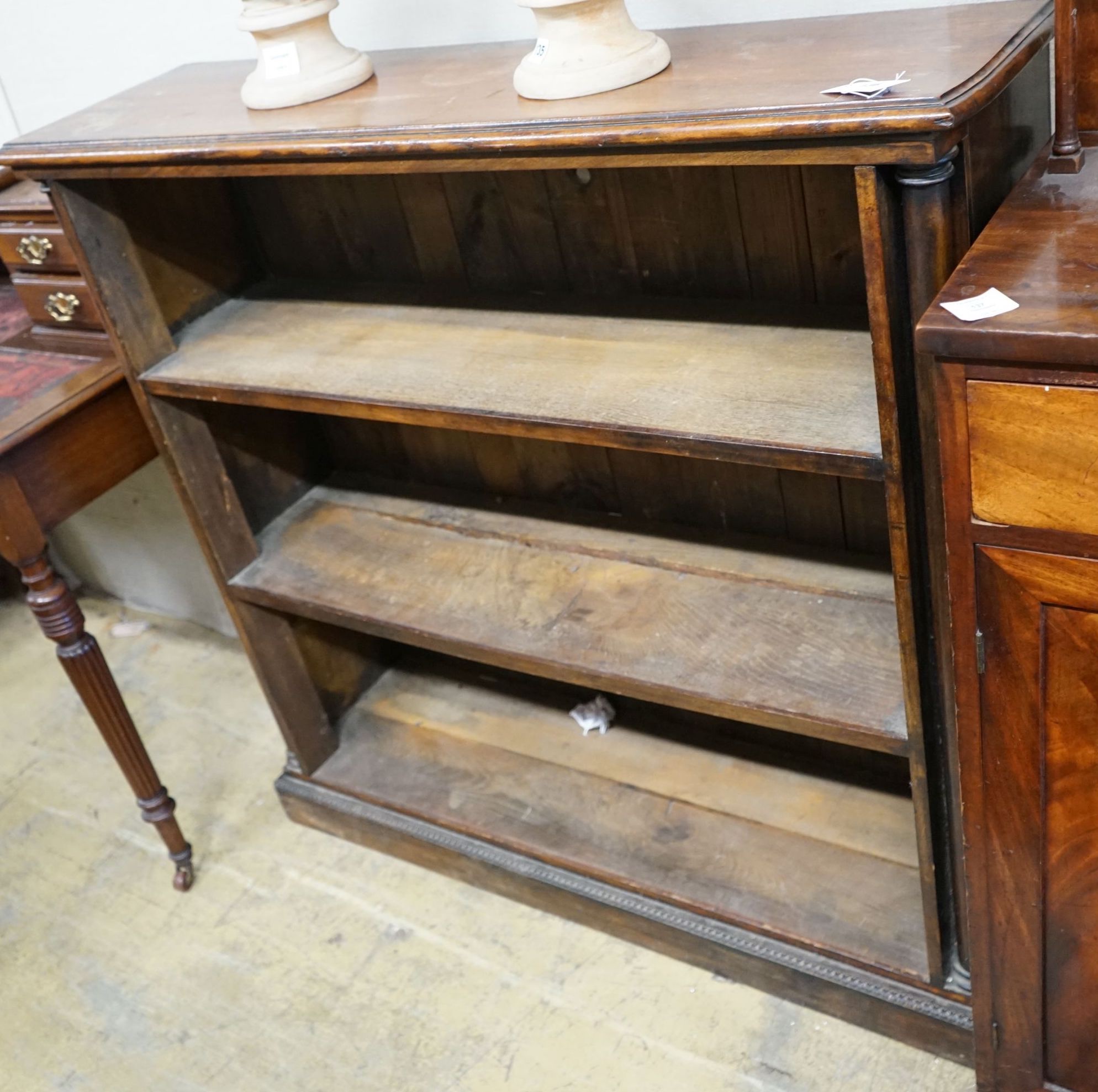 A Victorian mahogany open bookcase on carved plinth foot, width 114cm, depth 31cm, height 111cm